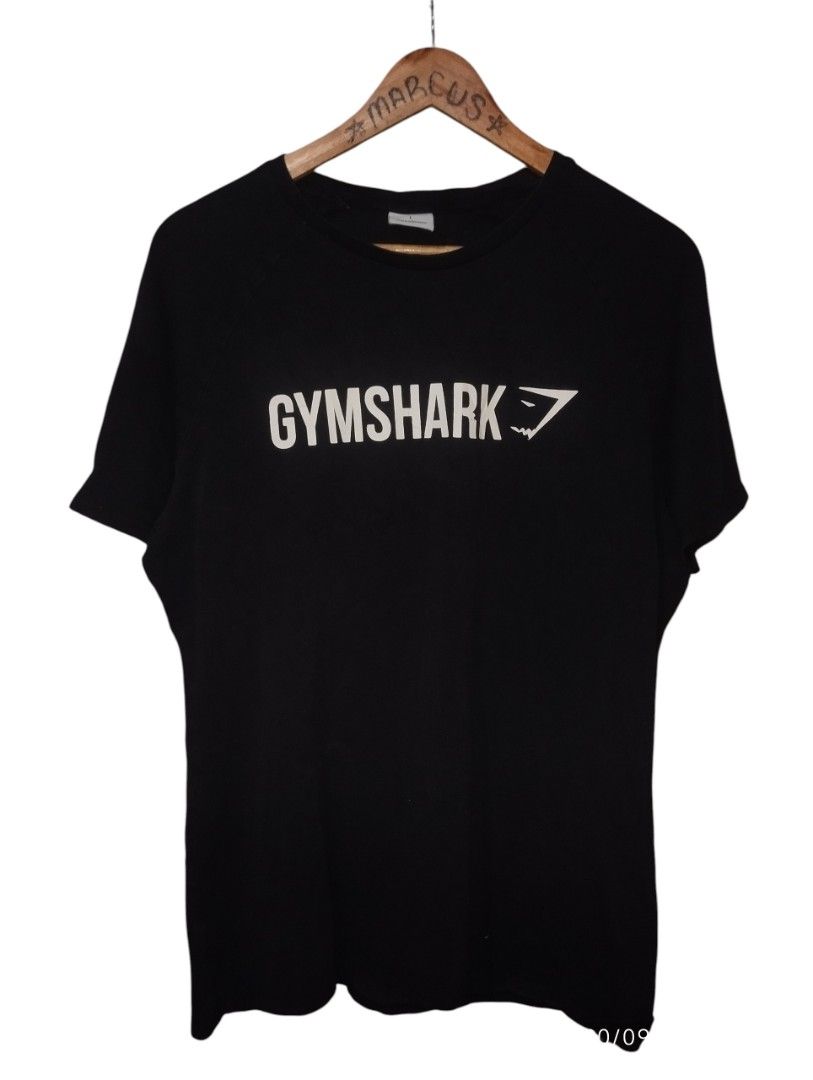 Gymshark Black T-Shirt (Category: Activewear) located in Manila. Submitted by thriftjepo01336 (Listing ID 1463128543, Image 1). Description: - Black Gymshark T-shirt - Classic Gymshark logo on the front - Comfortable and breathable material - Suitable for workouts or casual outings - Size Large (L) - Ready for its next owner!.