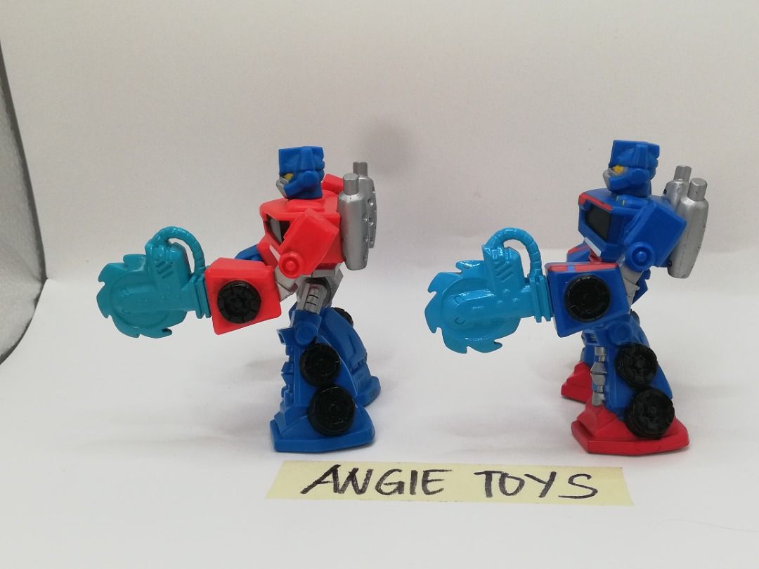 Hasbro Playskool Transformers Rescue Bots Optimus Prime Set - Red & Blue Variants (Category: Action & Battle Toys) located in Davao. Submitted by angiesvintagetoyshoppe (Listing ID 1463282076, Image 3). Description: Selling this matching pair of authentic 2014 Hasbro Playskool Heroes Transformers Rescue Bots Optimus Prime action figures. Great toddler-friendly size designed for sturdy, chunky play! Perfect for little hands or collectors completin