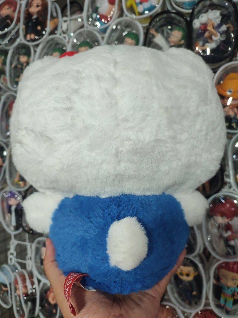 Hello Kitty 50th Anniversary Plush Toy (Category: Plushies & Soft Toys) located in Manila. Submitted by epicmountain-f20453 (Listing ID 1463225805, Image 3). Description: - Super cute Kitty plush toy - Special 50th Anniversary edition - Soft and fluffy white fur - Adorable blue overall outfit - Features embroidered Kitty logo on foot - Perfect collectible for fans - Officially licensed by Sanrio.