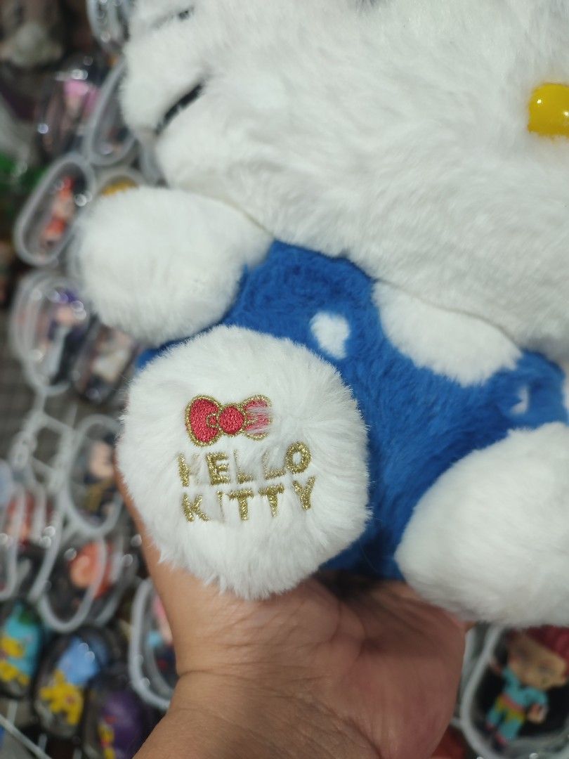 Hello Kitty 50th Anniversary Plush Toy (Category: Plushies & Soft Toys) located in Manila. Submitted by epicmountain-f20453 (Listing ID 1463225805, Image 2). Description: - Super cute Kitty plush toy - Special 50th Anniversary edition - Soft and fluffy white fur - Adorable blue overall outfit - Features embroidered Kitty logo on foot - Perfect collectible for fans - Officially licensed by Sanrio.
