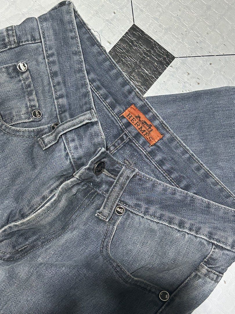 Hermes Denim Jeans Grey (Category: Jeans) located in San Simon. Submitted by ericdeinla69664 (Listing ID 1463143781, Image 3). Description: - Hermes Grey Denim Jeans - Classic Five-Pocket Style - Button and Zip Closure - Iconic Hermes Horse and Carriage Logo on Buttons - Branded Hermes Tab at Waist - Perfect for Casual Wear.