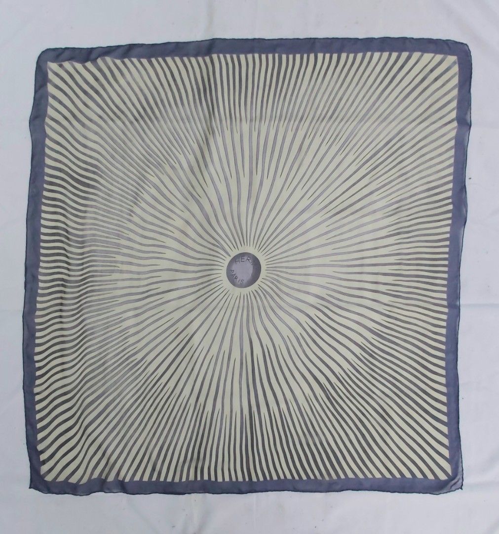 Hermes Paris Silk Scarf (Category: Scarves) located in Lapu Lapu. Submitted by agnesapm_29813 (Listing ID 1463230284, Image 2). Description: - Features a sunburst pattern with Hermes Paris logo at the center - Measurements: 49 inches x 47 inches - Versatile accessory to elevate any outfit - Hand rolled edges - No tag, no signature .