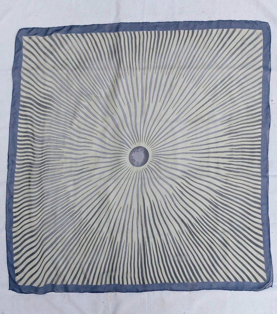 Hermes Paris Silk Scarf (Category: Scarves) located in Lapu Lapu. Submitted by agnesapm_29813 (Listing ID 1463230284, Image 1). Description: - Features a sunburst pattern with Hermes Paris logo at the center - Measurements: 49 inches x 47 inches - Versatile accessory to elevate any outfit - Hand rolled edges - No tag, no signature .