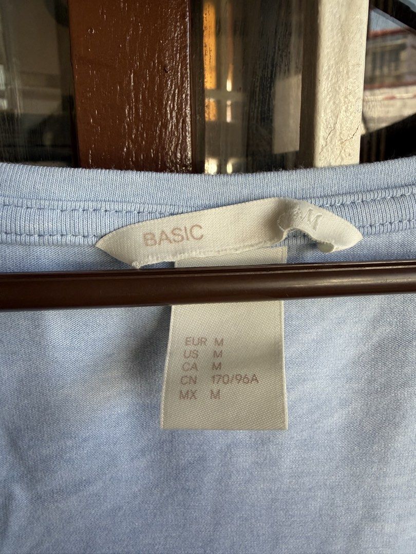 H&M Basic Light Blue V-Neck T-Shirt Size M (Category: Shirts) located in Las Pinas. Submitted by celly_belly (Listing ID 1463178413, Image 2). Description: - Light blue H&M basic tee - V-neck style with short sleeves - Comfortable for everyday wear - Size M (check photos for exact sizing) - Ideal for casual outfits.