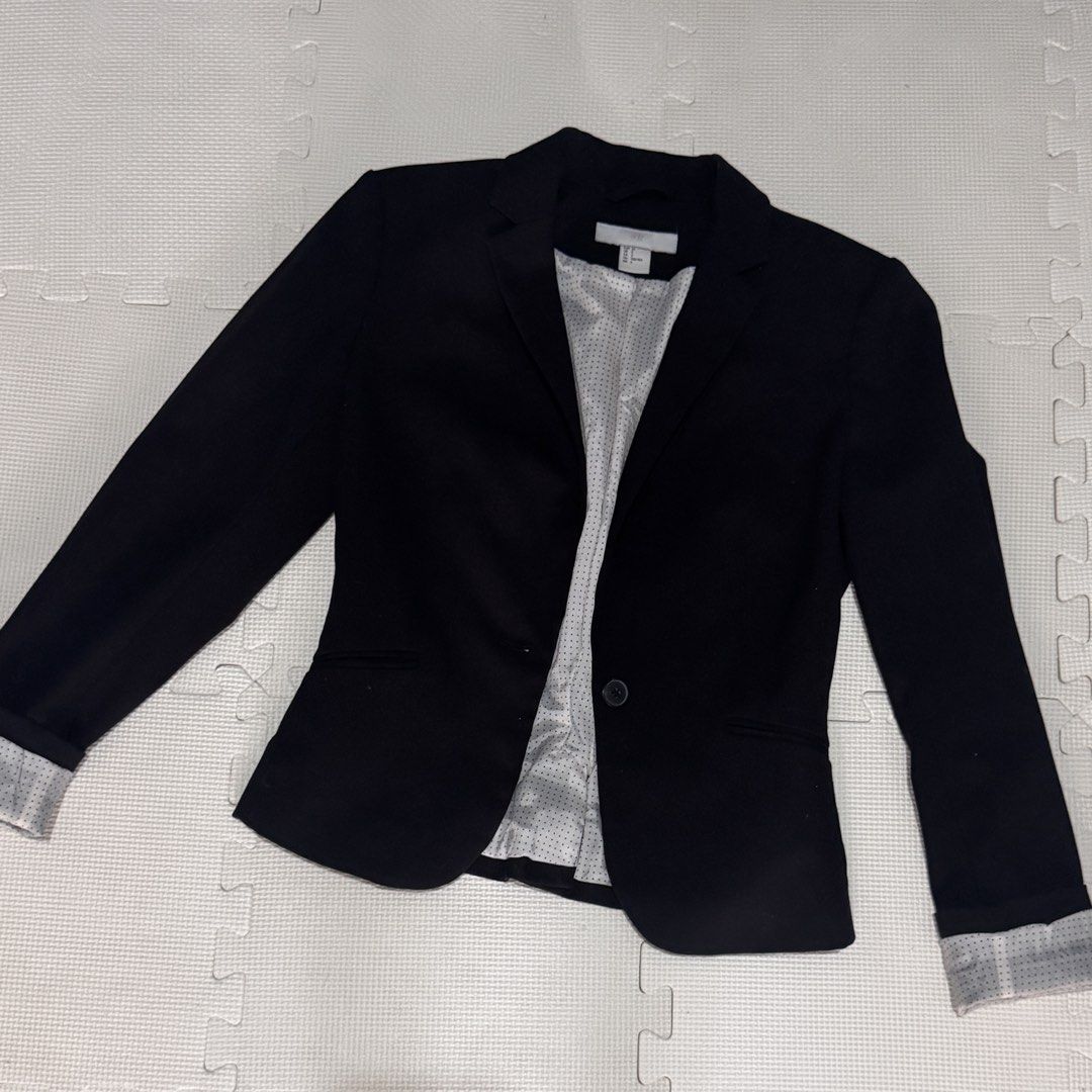 H&M Black Blazer with Polka Dot Lining (Category: Coats, Jackets and Outerwear) located in Marikina City. Submitted by prelovedsms (Listing ID 1463148901, Image 1). Description: - Classic black blazer from H&M - Features a chic polka dot lining - Cuffed sleeves reveal the lining - Single button closure - Versatile for work or a night out - Easy to style.