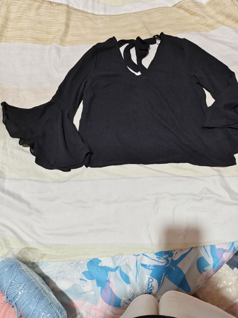 H&M Divided Black Bell Sleeve V-Neck Top (Category: Blouses) located in Manila. Submitted by immsuarez (Listing ID 1463311516, Image 1). Description: - Brand: H&M Divided - Color: Black - Features: Bell sleeves, V-neck with back tie detail - Estimated Size: US 8 - Versatile: Dress up or down.