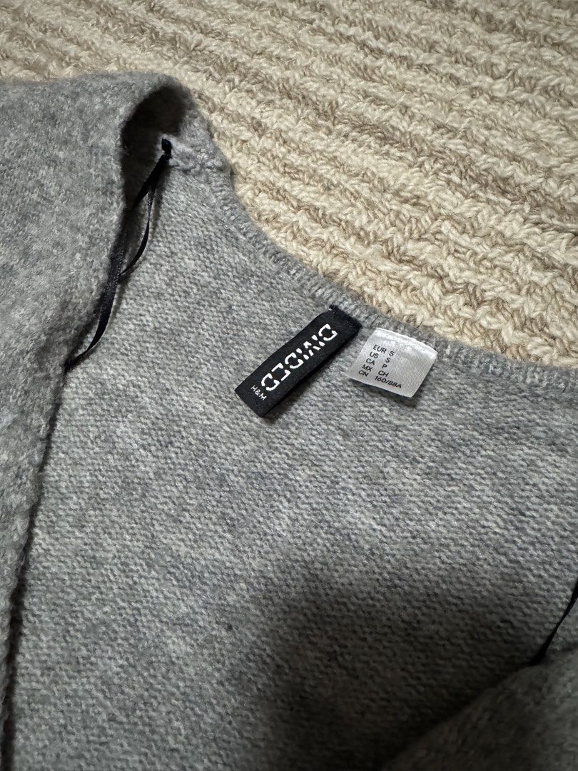 H&M Divided Grey Button-Up Cardigan (Category: Coats, Jackets and Outerwear) located in Manila. Submitted by haobinz_01 (Listing ID 1463259749, Image 2). Description: - Grey H&M Divided cardigan - Long sleeves with button-up front - Ribbed cuffs and hem - Soft knit material - Estimated size XS/S - Ideal for layering .