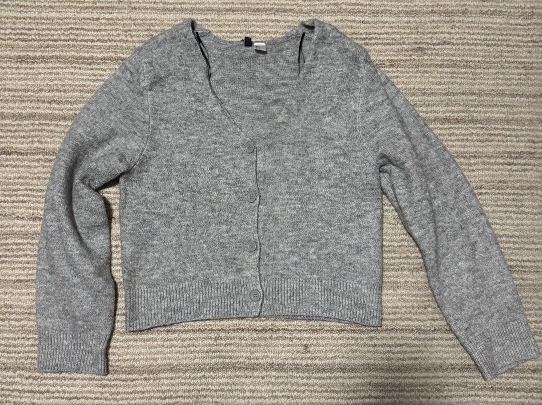H&M Divided Grey Button-Up Cardigan (Category: Coats, Jackets and Outerwear) located in Manila. Submitted by haobinz_01 (Listing ID 1463259749, Image 1). Description: - Grey H&M Divided cardigan - Long sleeves with button-up front - Ribbed cuffs and hem - Soft knit material - Estimated size XS/S - Ideal for layering .