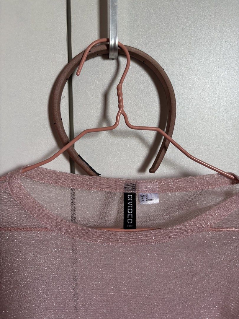 H&M Divided Pink Glittery Long Sleeve Top (Category: Longsleeves) located in Baguio. Submitted by pinkynj (Listing ID 1463188029, Image 2). Description: - Pink glittery long sleeve top from H&M Divided - Sheer material with a subtle sparkle - Perfect for layering or wearing solo - Size: EUR 36 / US 6 / UK 8 - Note: Small stain on sleeve (refer to last photo for details).
