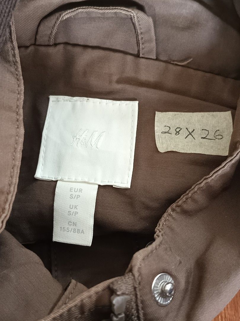 H&M Hooded Jacket S/P Brown (Category: Coats, Jackets and Outerwear) located in Calamba. Submitted by sulitshopaholic (Listing ID 1463261991, Image 2). Description: - H&M Brown Hooded Jacket - Size: S/P - Dimes: 28L X 26W - Features: Drawstring waist, button-up front - Ideal for cooler weather - Please check photos for detailed measurements.