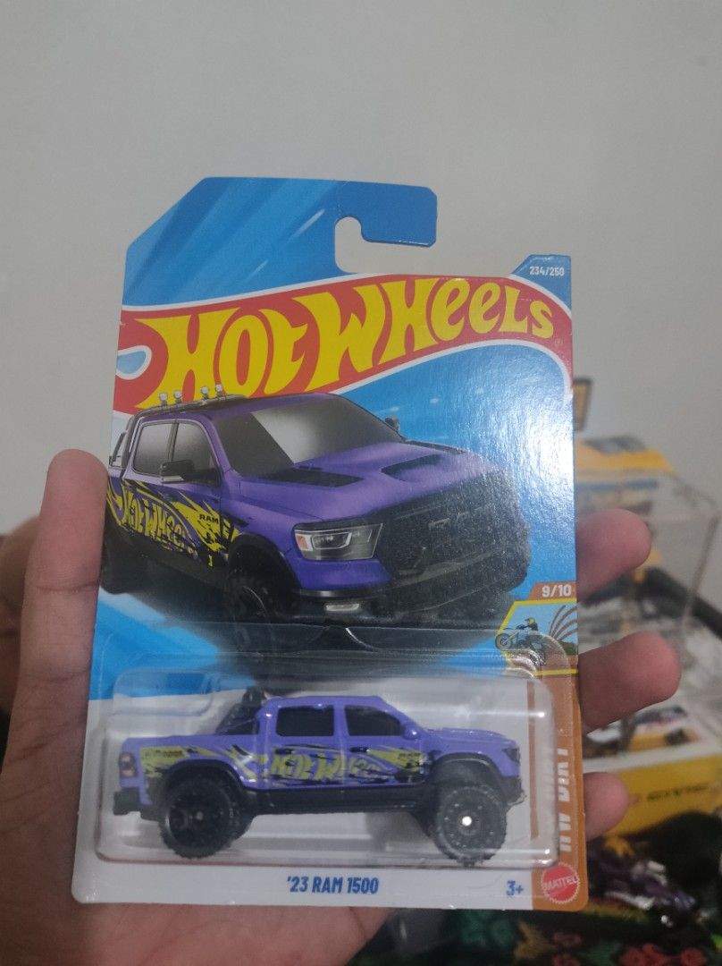 Hot Wheels '23 Ram 1500 Purple (Category: Vehicle & Diecast Models) located in Makati City. Submitted by chan_123456 (Listing ID 1463247154, Image 1). Description: - Brand New: Purple '23 Ram 1500 Hot Wheels car - Eye-Catching Design: Features cool yellow and black graphics - Original Packaging: Comes sealed and ready for display - Collector's Item: A must-have for any Hot Wheels enthusiast - Ready for a New Home: Add this awesome truck to your c