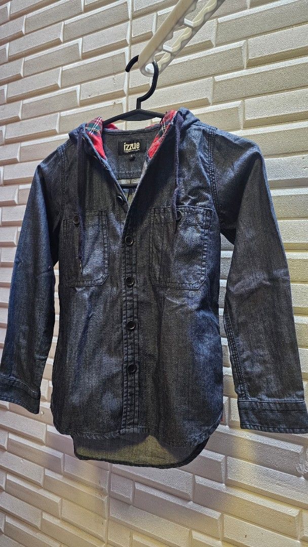 Izzy Denim Jacket with Plaid Lining (Category: Babies & Kids Fashion) located in Quezon City. Submitted by dawnest (Listing ID 1463278315, Image 1). Description: - Izzy dark wash denim jacket - Red and black plaid lining - Button-up front with chest pockets - Drawstring hood - Size L - Ideal for layering.