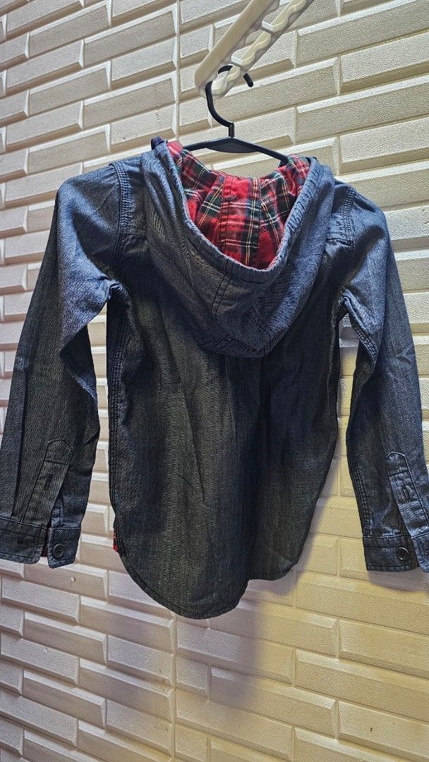 Izzy Denim Jacket with Plaid Lining (Category: Babies & Kids Fashion) located in Quezon City. Submitted by dawnest (Listing ID 1463278315, Image 3). Description: - Izzy dark wash denim jacket - Red and black plaid lining - Button-up front with chest pockets - Drawstring hood - Size L - Ideal for layering.