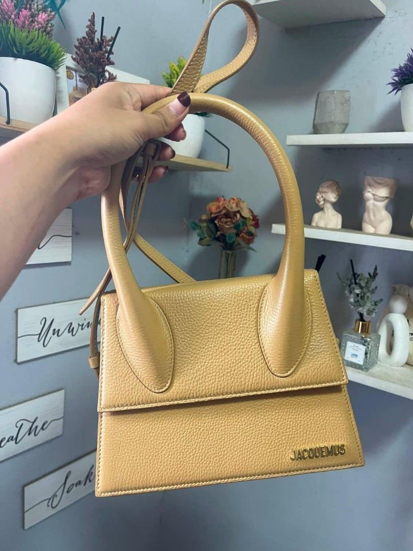Jacquemus Le Chiquito Bag (Category: Luxury Bags & Wallets) located in Manila. Submitted by jdenzel1110 (Listing ID 1463147521, Image 2). Description: - Classic Jacquemus bag in tan/camel color - Pebbled leather texture - Features a top handle and a detachable shoulder strap - Elegant gold hardware with Jacquemus logo - Compact and stylish, ideal for carrying essentials - Minimalist and chic design The condition is good pm me for more info and be