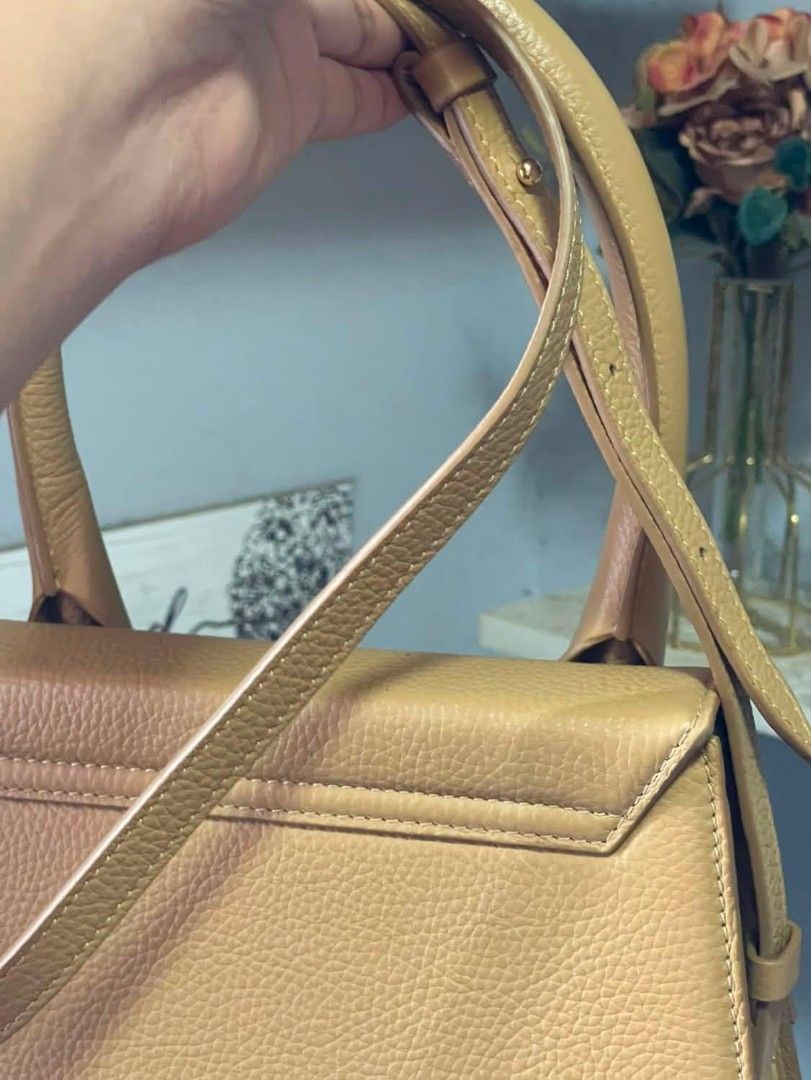 Jacquemus Le Chiquito Bag (Category: Luxury Bags & Wallets) located in Manila. Submitted by jdenzel1110 (Listing ID 1463147521, Image 3). Description: - Classic Jacquemus bag in tan/camel color - Pebbled leather texture - Features a top handle and a detachable shoulder strap - Elegant gold hardware with Jacquemus logo - Compact and stylish, ideal for carrying essentials - Minimalist and chic design The condition is good pm me for more info and be