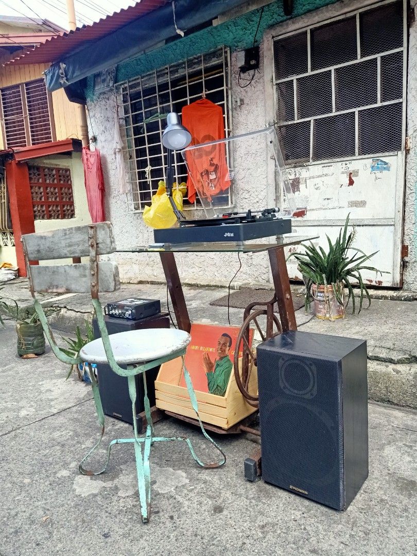 JAM TURNTABLE SET-UP WITH SPEAKERS (Category: Soundbars, Speakers & Amplifiers) located in Caloocan City. Submitted by ryanpaulpalomado12 (Listing ID 1463203057, Image 2). Description: +FOR SALE+ P9,500 TAKE ALL JAM TURNTABLE WITH 2WAY PIONEER SPEAKERS WITH AMPLIFIER AND LIGHT LAMP WITH STAND OLD MAKINA WITH TOP GLASS AND WOOD CHAIR WITH LAGAYAN NG PLAKA AT 3PCS PLAKA GAGAMITIN MO NALANG PO.. PWEDENG PWEDE SA MANCAVE MO.. LOCATION : BAGONG BARRIO