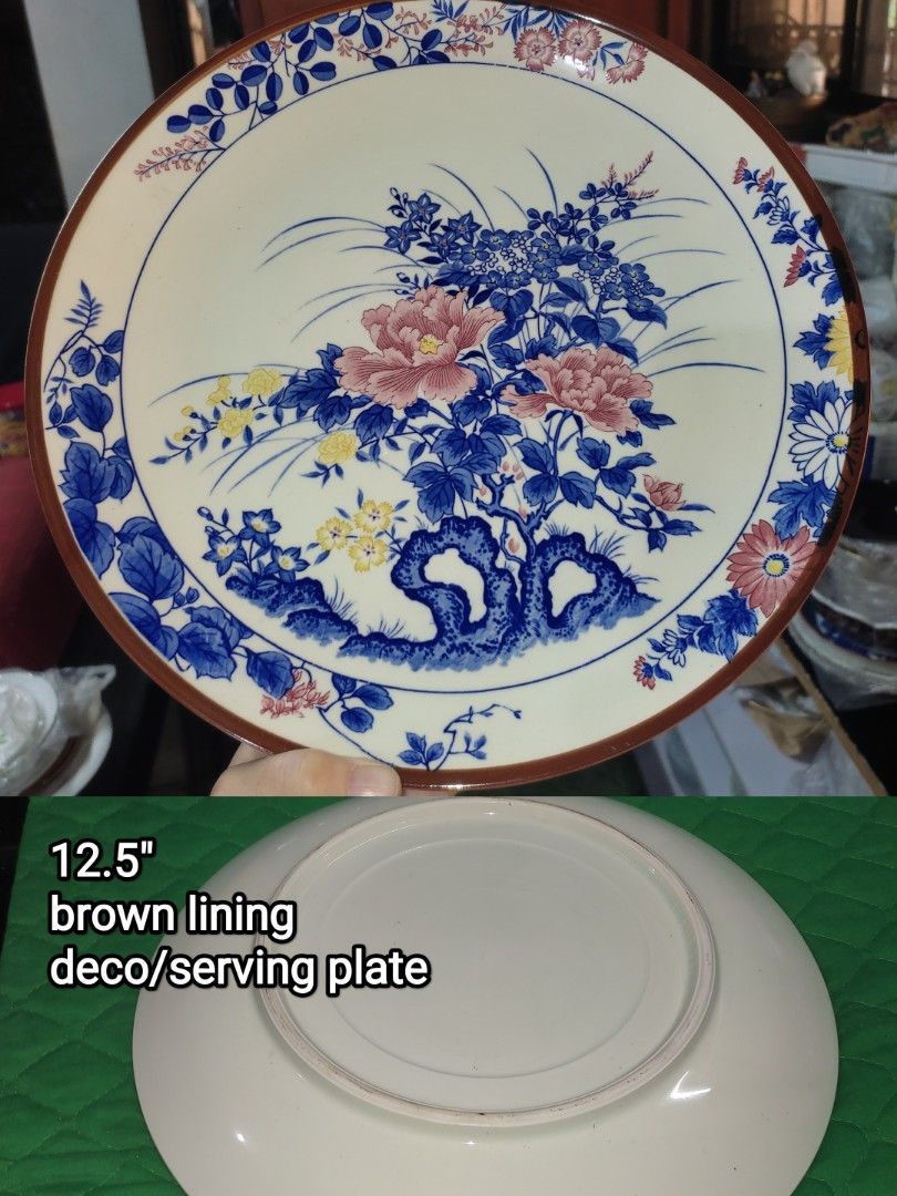 Japanese Style Ceramic Dinnerware Set - Take All 1,200 (Category: Dinnerware & Cutlery) located in Manila. Submitted by margeventa (Listing ID 1463230116, Image 2). Description: - Authentic Japanese-style ceramic dinnerware set. - Includes: 1 large 12.5" serving plate (brown lining, floral deco), 3 small bowls (6" x 1.8" deep, floral patterns), 1 decorative lidded bowl, 1 square dish. - Comes with chopsticks. - Ideal for serving meals or as a dec