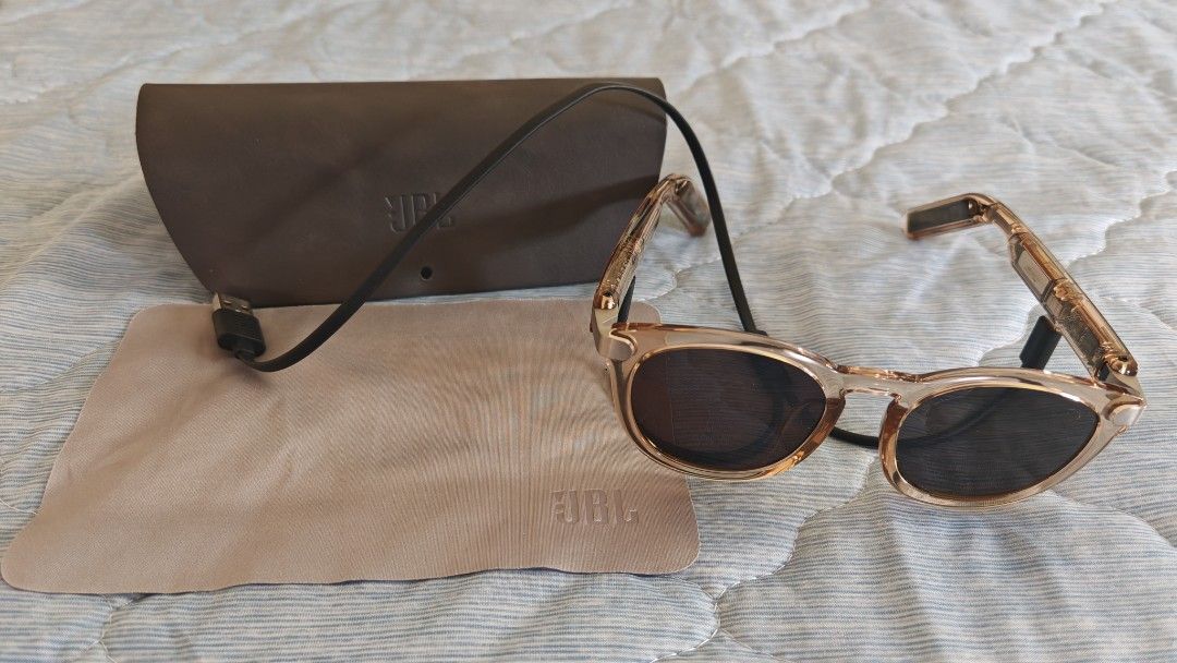 JBL Sunglasses with Case and Cleaning Cloth (Category: Sunglasses & Eyewear) located in Taguig. Submitted by uyprecious (Listing ID 1463174932, Image 1). Description: - Stylish JBL sunglasses - Chic rose gold frame - Dark, protective lenses - Includes original brown case with attached USB cable - Comes with a cleaning cloth - working well, used once to try Rfs: not really using shades.