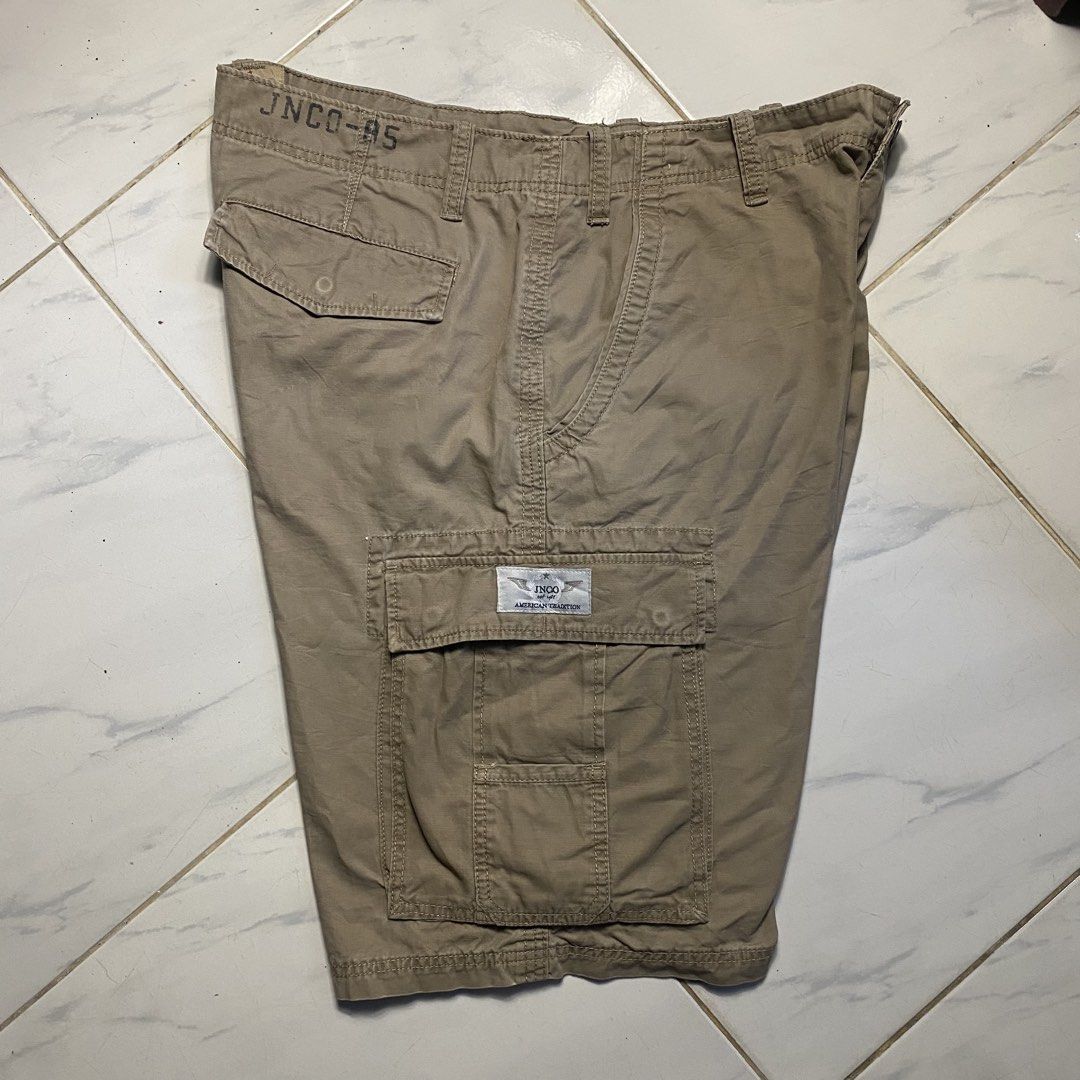 JNCO Authentic Cargo Shorts Khaki (Category: Shorts) located in Camiling. Submitted by camthrift_2024 (Listing ID 1463167038, Image 1). Description: JNCO CARGO KHAKI WAIST: 40 THIGH: 13.5 LENGHT: 23.5 LEG OPENING/HEM: 13 COLOR RATE: 9/10 ISSUE:❌❌❌ 450₱ SHIP NOW OPEN FOR TERMS UNLI VOUCH GCASH JNT CAMILING, TARLAC📌 - Authentic JNCO khaki cargo shorts - Multiple functional pockets - Secure button and zip closure - Ideal for casual and everyday wea