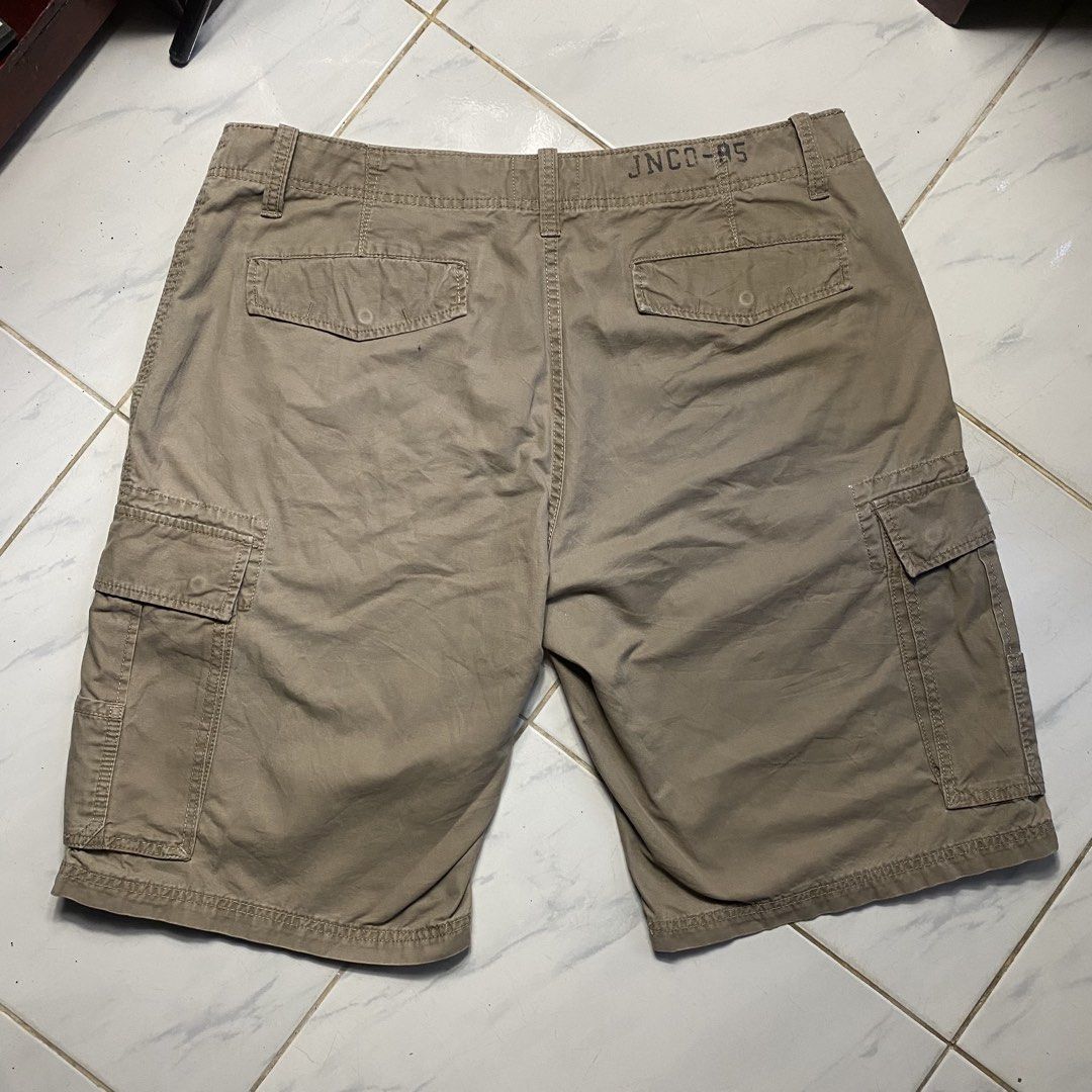 JNCO Authentic Cargo Shorts Khaki (Category: Shorts) located in Camiling. Submitted by camthrift_2024 (Listing ID 1463167038, Image 3). Description: JNCO CARGO KHAKI WAIST: 40 THIGH: 13.5 LENGHT: 23.5 LEG OPENING/HEM: 13 COLOR RATE: 9/10 ISSUE:❌❌❌ 450₱ SHIP NOW OPEN FOR TERMS UNLI VOUCH GCASH JNT CAMILING, TARLAC📌 - Authentic JNCO khaki cargo shorts - Multiple functional pockets - Secure button and zip closure - Ideal for casual and everyday wea