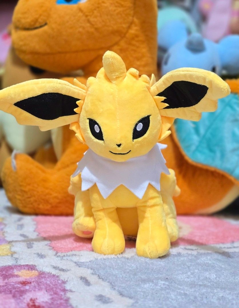 Jolteon Pokemon Plush Toy (Category: Plushies & Soft Toys) located in Paranaque City. Submitted by vanchris84 (Listing ID 1463266934, Image 1). Description: - Cute yellow Jolteon plush - Approximately 8 inches tall - Ideal for any Pokemon fan - Perfect for display or cuddling - Ready to find a new home.