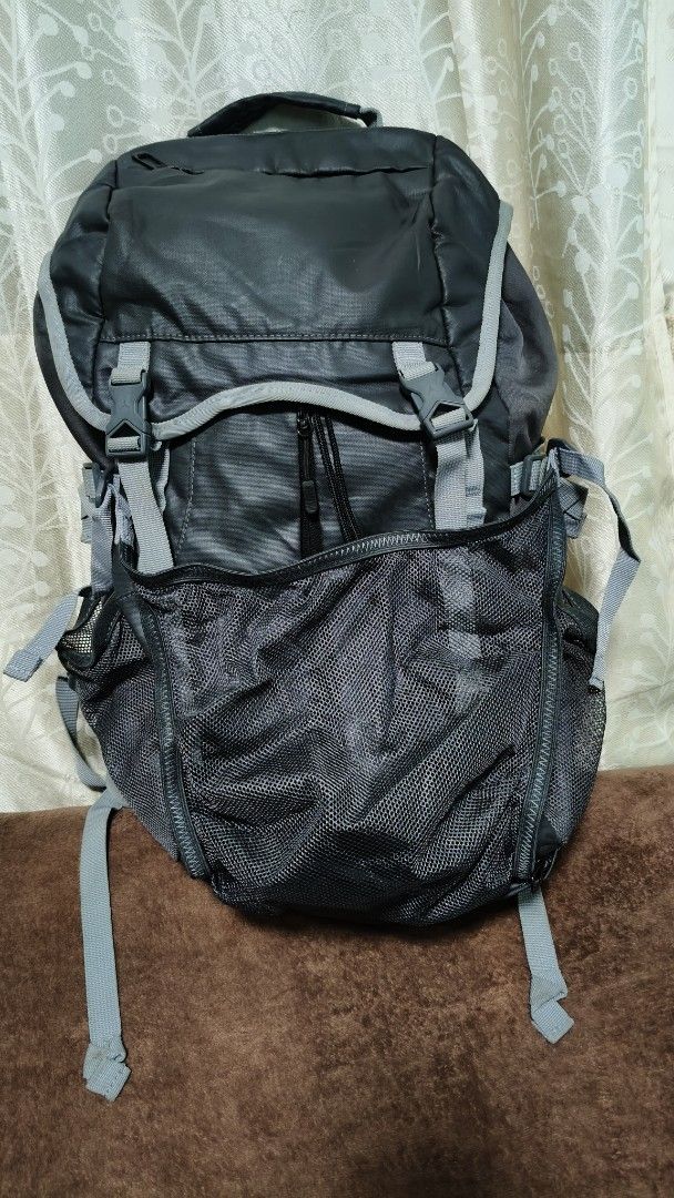 Jordan Black Grey Backpack (Category: Backpacks) located in Manila. Submitted by serenitycarlylle (Listing ID 1463300710, Image 1). Description: - Stylish black and grey Jordan backpack. - Main compartment with secure drawstring and buckle closure. - Convenient front mesh pocket with zippers. - Dual side mesh pockets perfect for water bottles. - Comfortable padded shoulder straps. - Please note: Some wear on the strap as pictured..