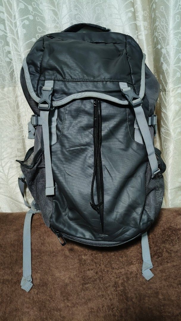 Jordan Black Grey Backpack (Category: Backpacks) located in Manila. Submitted by serenitycarlylle (Listing ID 1463300710, Image 2). Description: - Stylish black and grey Jordan backpack. - Main compartment with secure drawstring and buckle closure. - Convenient front mesh pocket with zippers. - Dual side mesh pockets perfect for water bottles. - Comfortable padded shoulder straps. - Please note: Some wear on the strap as pictured..