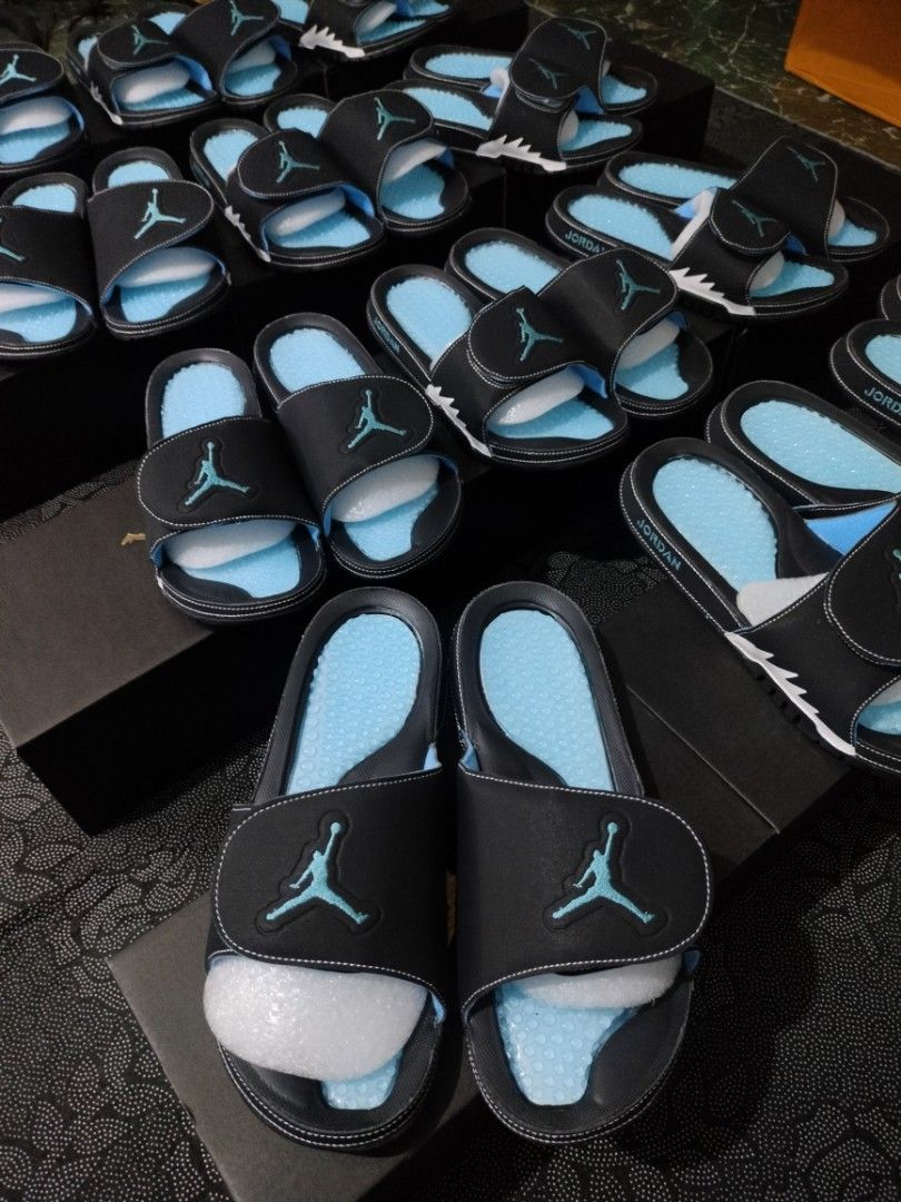 Jordan Hydro Unc (Category: Slippers & Slides) located in Manila. Submitted by janpaul15 (Listing ID 1463186750, Image 2). Description: - Stylish black Jordan slides with eye-catching light blue accents. - Features the iconic Jordan logo prominently on the strap. - Designed for ultimate comfort, perfect for everyday wear. - Multiple pairs are available, so you can choose your perfect fit..