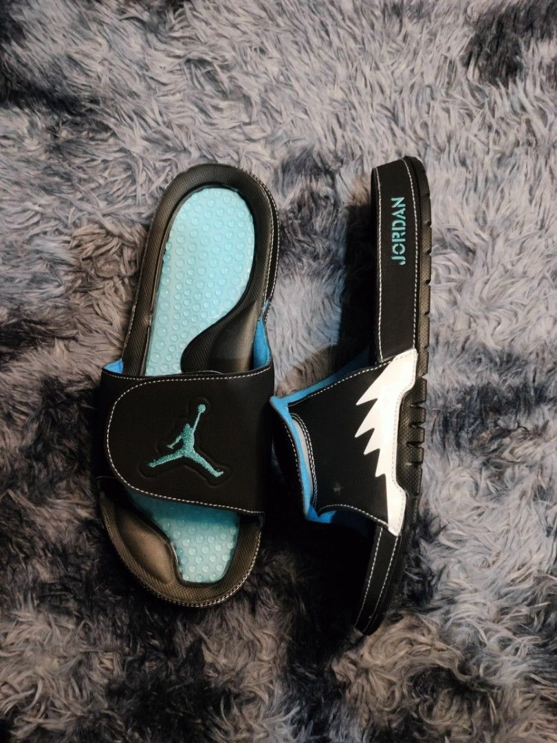 Jordan Hydro Unc (Category: Slippers & Slides) located in Manila. Submitted by janpaul15 (Listing ID 1463186750, Image 3). Description: - Stylish black Jordan slides with eye-catching light blue accents. - Features the iconic Jordan logo prominently on the strap. - Designed for ultimate comfort, perfect for everyday wear. - Multiple pairs are available, so you can choose your perfect fit..