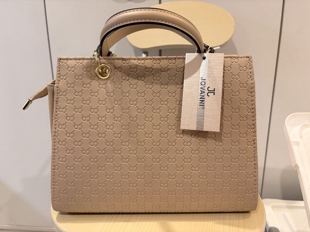 JOVANI Beige Monogram Top Handle Bag with Scarf (Category: Luxury Bags & Wallets) located in Manila. Submitted by jonahgmzn (Listing ID 1463227140, Image 1). Description: - Beige JOVANI handbag with all-over monogram pattern. - Features a top handle and a detachable shoulder strap for versatile carrying. - Adorned with a cute matching scarf tied to the handle. - Elegant gold hardware details. - Ideal for both everyday use and special occasions. -
