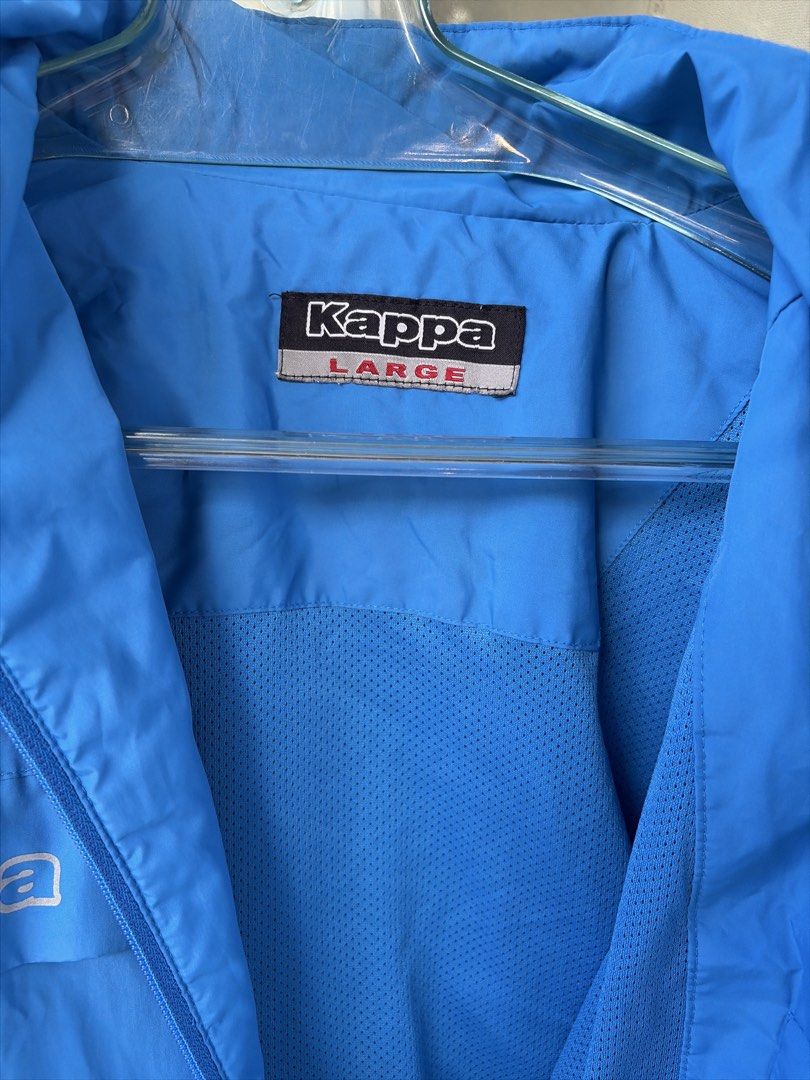 Kappa Blue Windbreaker Jacket (Category: Coats, Jackets and Outerwear) located in Bulacan. Submitted by aarchive (Listing ID 1463322373, Image 3). Description: - Blue Kappa jacket - Full zip closure with stand-up collar - Two front pockets - Kappa logo on chest and sleeves - Large Kappa logo on the back - Made of lightweight material - Ideal for outdoor activities or casual wear.