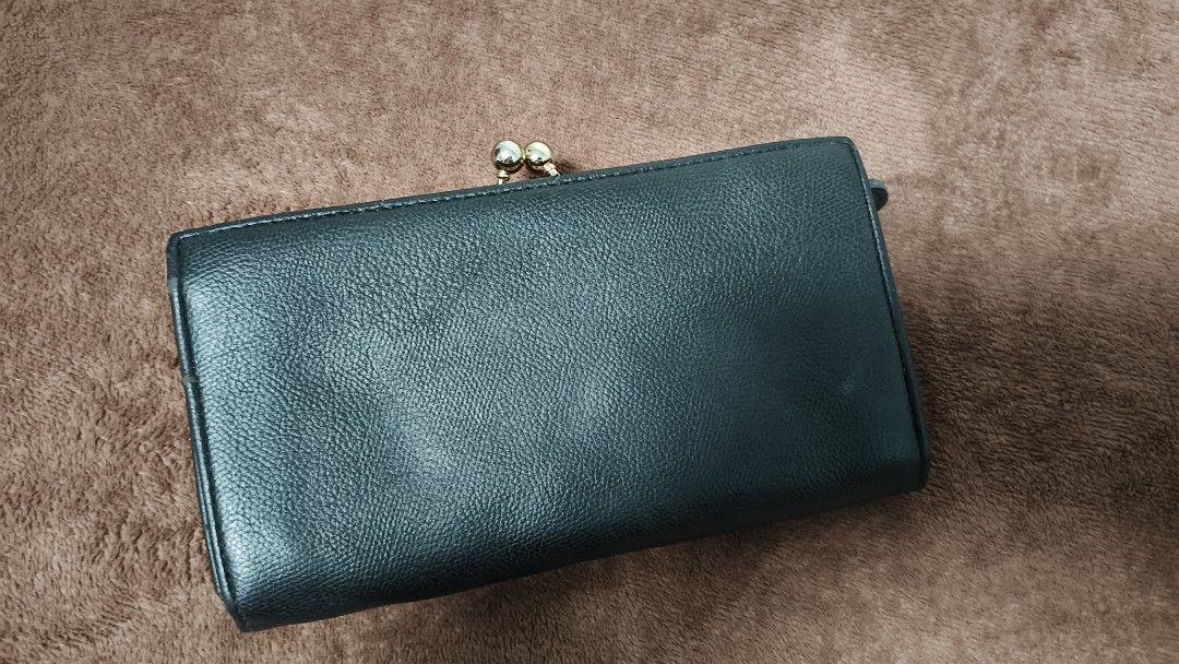 Kardashian Collection Black Textured Wallet (Category: Wallets & Card holders) located in Manila. Submitted by serenitycarlylle (Listing ID 1463300975, Image 2). Description: - Kardashian Collection black wallet - Textured exterior with gold trim detail - Secure clasp closure - Multiple card slots - Clear ID window - Zippered compartment for extra storage - Ideal for keeping your essentials organized.