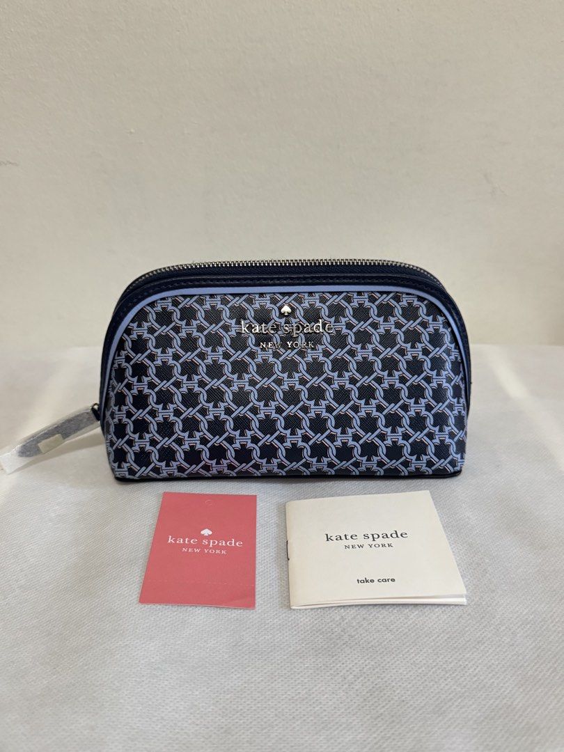 Kate Spade Cosmetic Bag - Navy Blue Chain Link Pattern (Category: Purses & Pouches) located in Bacoor. Submitted by nikkaroseee (Listing ID 1463151594, Image 1). Description: - Authentic Kate Spade cosmetic bag - Stylish navy blue and light blue chain link pattern - Secure zipper closure - Interior features signature spade pattern lining - Brand new with original tags and care card - Ideal for travel or everyday organization.