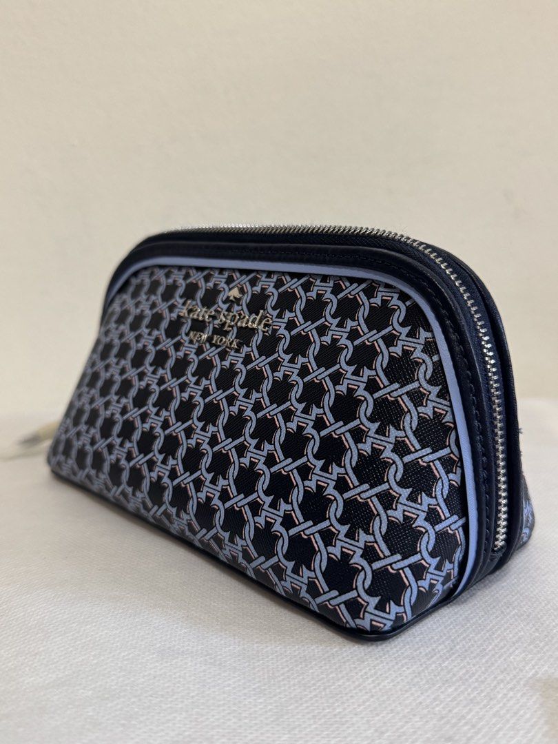 Kate Spade Cosmetic Bag - Navy Blue Chain Link Pattern (Category: Purses & Pouches) located in Bacoor. Submitted by nikkaroseee (Listing ID 1463151594, Image 3). Description: - Authentic Kate Spade cosmetic bag - Stylish navy blue and light blue chain link pattern - Secure zipper closure - Interior features signature spade pattern lining - Brand new with original tags and care card - Ideal for travel or everyday organization.