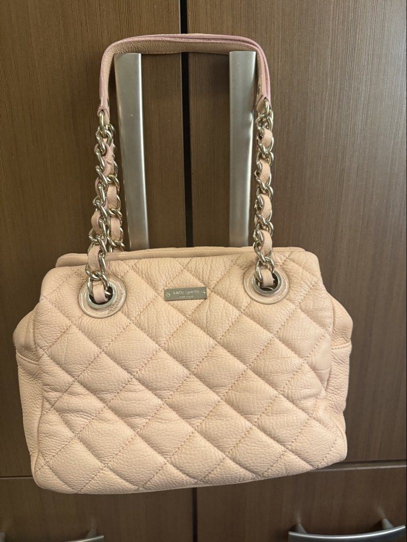 Kate Spade Pink Quilted Leather Shoulder Bag (Category: Luxury Bags & Wallets) located in Taguig. Submitted by migraineur (Listing ID 1463164867, Image 1). Description: - Brand: Kate Spade New York - Color: Light Pink - Material: Quilted Leather - Style: Shoulder Bag - Features: Chain strap, top handle, zipper closure - Condition: Very light corner wear - Ideal for: Everyday use Size: Medium Sized and Roomy Width 27cm Height 20cm Depth 14cm.