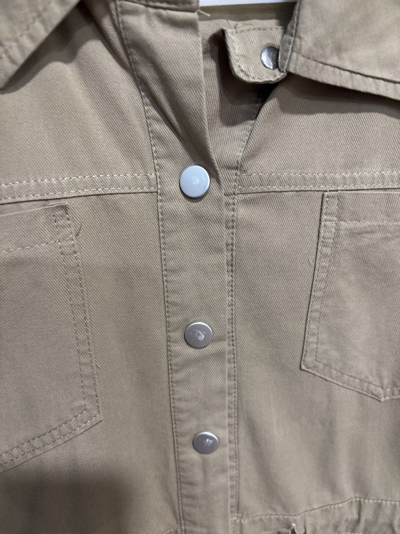 Khaki Button-Up Utility Dress with Drawstring Waist (Category: Dresses) located in Mandaluyong City. Submitted by clothescarousel (Listing ID 1463259692, Image 3). Description: - Khaki utility dress - Short sleeves - Collared neckline - Button-up front with silver buttons - Drawstring waist for a cinched silhouette - Two chest pockets - Two side pockets - Ideal for casual outfits.