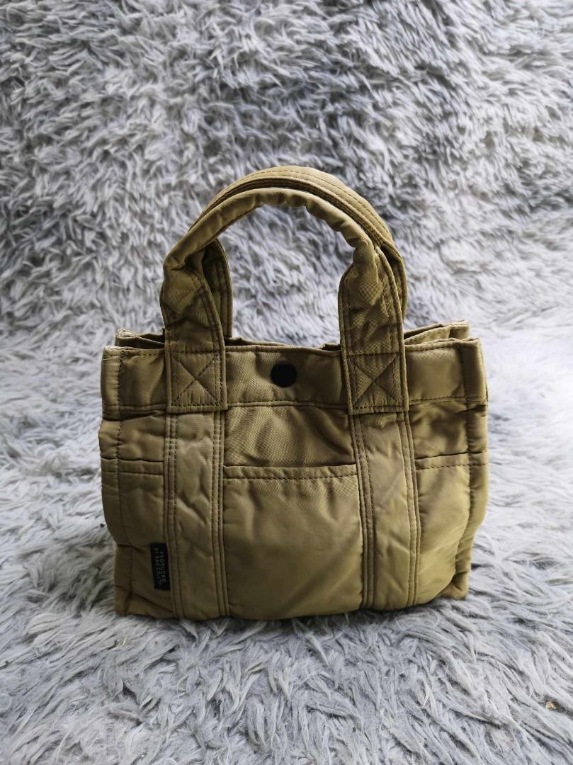Khaki Snap Closure Structured Mini Tote Bag (Category: Purses & Pouches) located in Santa Cruz. Submitted by jmy_surplus.2 (Listing ID 1463124623, Image 1). Description: Size ; L - 7.2 W - 9.2 Color ; Khaki Type ; Tote bag Brand ; No brand Material ; Nylon Style ; Quilted nylon Mini Tote Bag LR 129 JMY 3 Batch #223.