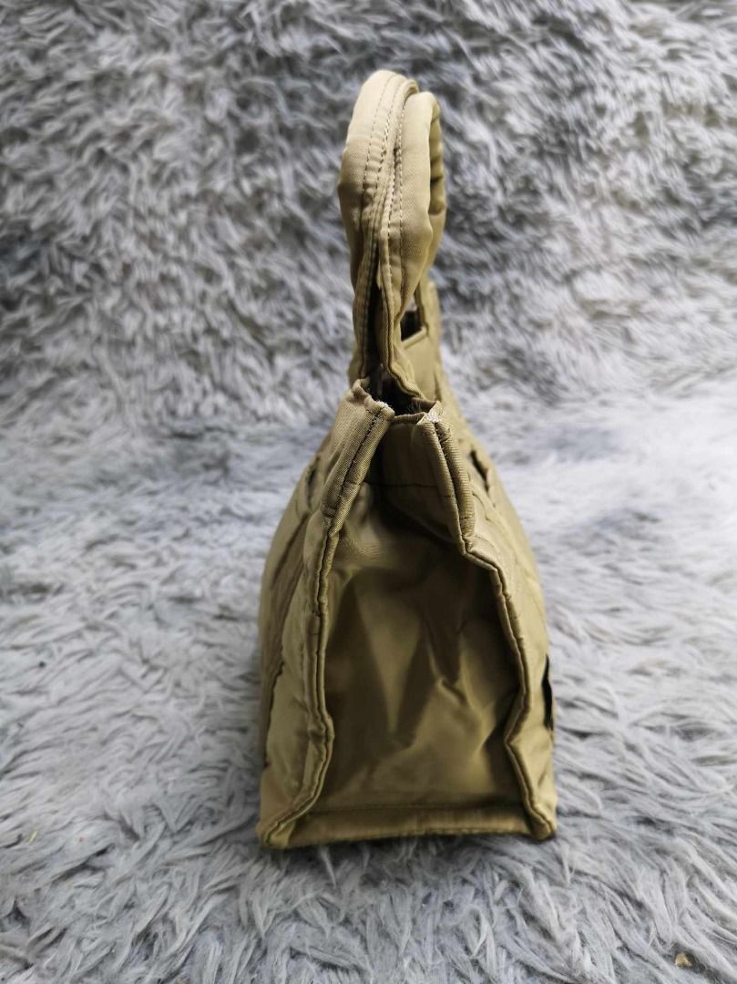 Khaki Snap Closure Structured Mini Tote Bag (Category: Purses & Pouches) located in Santa Cruz. Submitted by jmy_surplus.2 (Listing ID 1463124623, Image 2). Description: Size ; L - 7.2 W - 9.2 Color ; Khaki Type ; Tote bag Brand ; No brand Material ; Nylon Style ; Quilted nylon Mini Tote Bag LR 129 JMY 3 Batch #223.