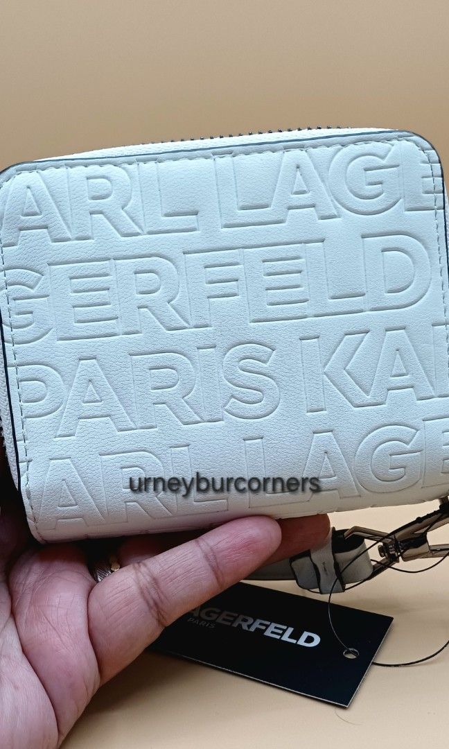 KL MARIBEL WINTER WHITE ZIP COMPACT WALLET (Category: Wallets & Card holders) located in Imus. Submitted by urneyburcorners (Listing ID 1463142864, Image 2). Description: Zip snap wallet Detach Strap Interior slip pocket, bills pockets, coin pocket. 100% cow lether, trim 100% polyurethane, lining 100% polyester Bought from USA brand outlet, with tag. Dims: 4"W x 4"H x 1"D.