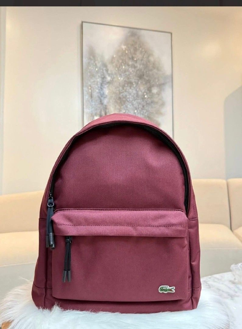 Lacoste Backpack - Multiple Colors Available (Category: Luxury Bags & Wallets) located in Makati City. Submitted by time.flip (Listing ID 1463142549, Image 3). Description: - Classic Lacoste backpack - Features iconic crocodile logo - Available in multiple colors (as shown) - Durable material, perfect for everyday use - Spacious main compartment - Convenient front zip pocket - Adjustable shoulder straps for comfort - Simple and stylish design.