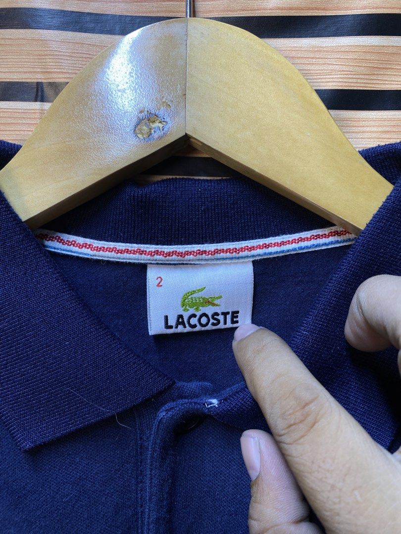 LACOSTE POLO SHIRT (CROP) (Category: Shirts) located in Makati City. Submitted by drip.poww (Listing ID 1463290862, Image 3). Description: - Authentic Lacoste - Color: Navy blue - Size: Small - Dimes: 19x20 - Authentic - Excellent condition - Need wash, fresh from bale - Material: 100% Cotton Please don’t expect too much—these are thrifted (ukay) items. 😊 !!STILL NEGOTIABLE!!.