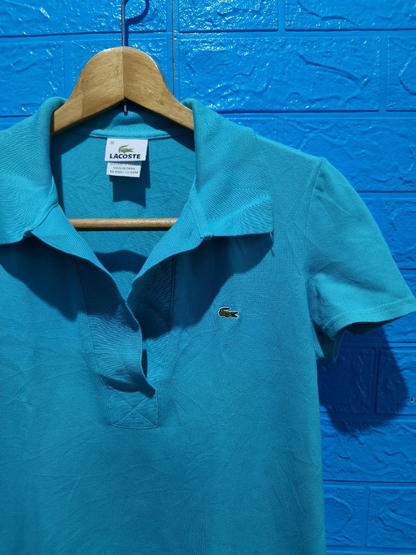 Lacoste Polo Shirt Size 38 Teal (Category: Others Tops) located in Davao. Submitted by vndrgd (Listing ID 1463120415, Image 2). Description: - Teal Lacoste Polo Shirt - Size: 38 - Measurements: Width 17.5 inches, Length 25 inches - Features iconic crocodile logo on chest - Made in China - Ideal for casual wear.
