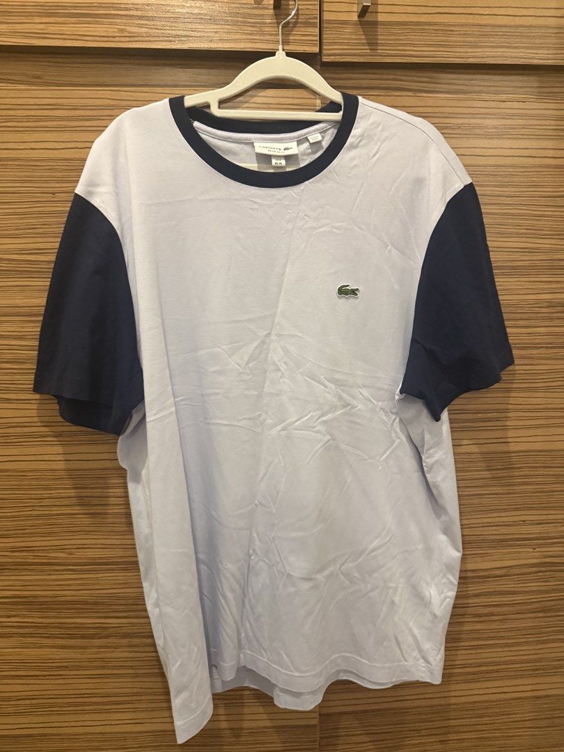 Lacoste Regular Fit T-shirt - White/Navy (Category: Tshirts & Polo Shirts ) located in Makati City. Submitted by stallionmegx (Listing ID 1463221975, Image 1). Description: - Classic Lacoste T-shirt - White body with navy blue sleeves and collar trim - Regular fit - Size XL - Made in Egypt - Ideal for casual wear.