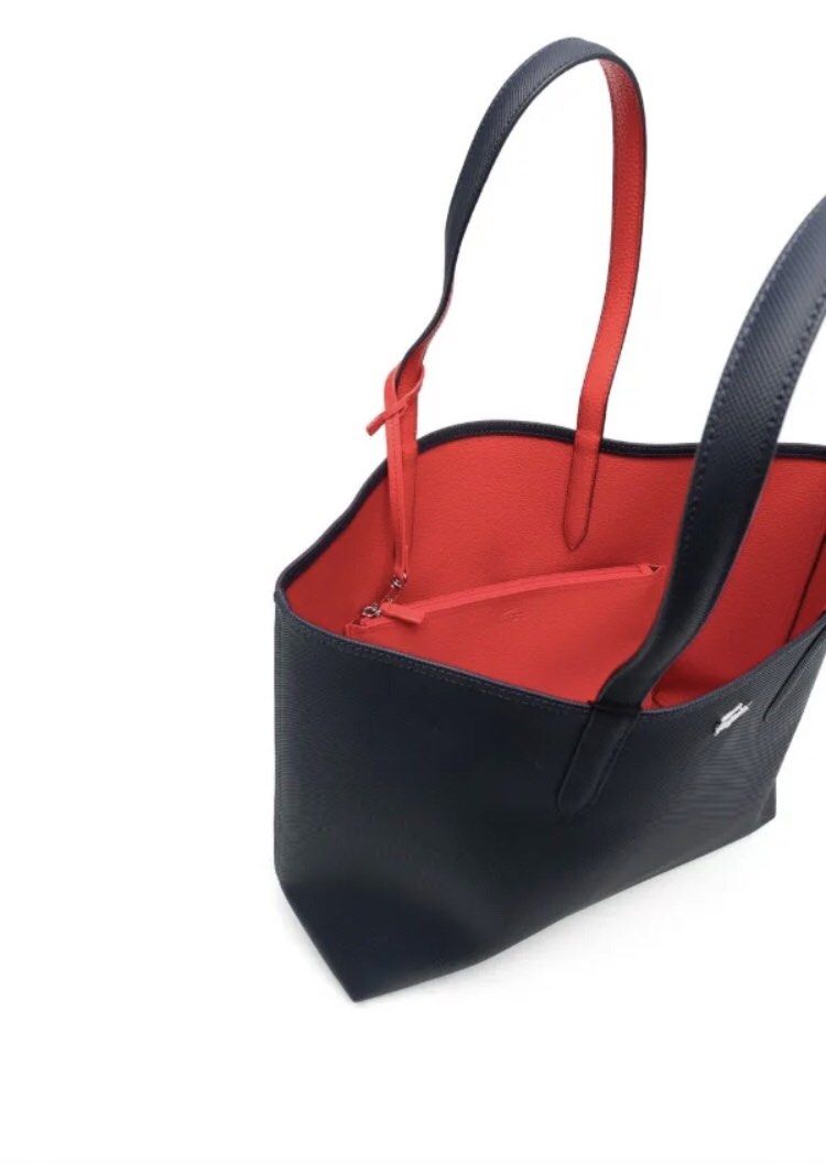 Lacoste Reversable Anna Tote Tennis (Category: Clutches) located in Manila. Submitted by hannaming (Listing ID 1463192007, Image 2). Description: Slightly Used. Planning to buy bag with zipper :) With dust bag.