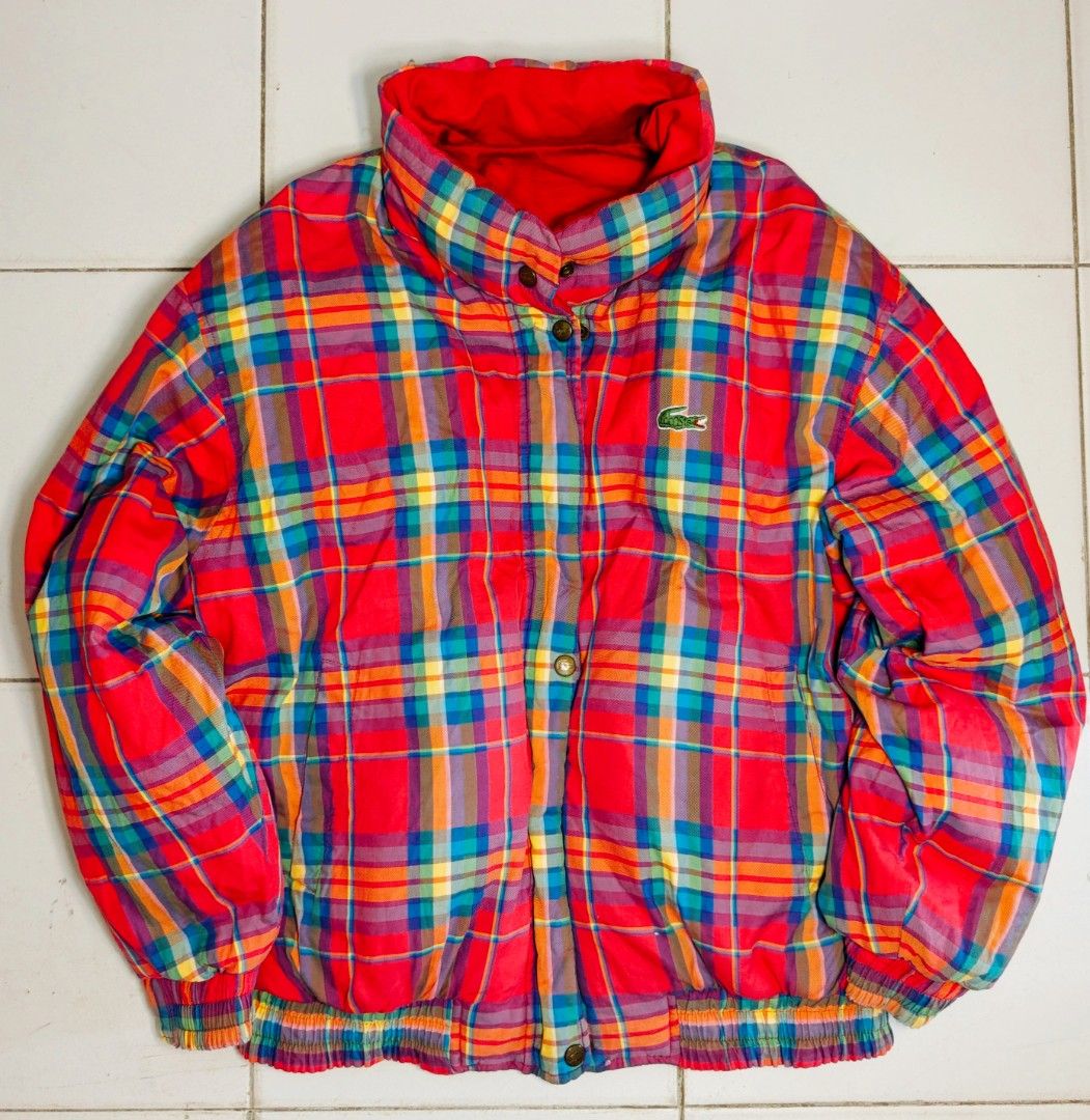 Lacoste Reversible Plaid Bomber Jacket Red (Category: Coats, Jackets and Outerwear) located in Manila. Submitted by teyobz_88 (Listing ID 1463161202, Image 2). Description: - Reversible Lacoste jacket - Side 1: Bright red with iconic crocodile logo - Side 2: Vibrant plaid pattern - Elasticated cuffs and hem - Zipper and button closure - Adds a pop of color to any outfit - Ideal for cooler weather - medium to large - 24x29 dimension.
