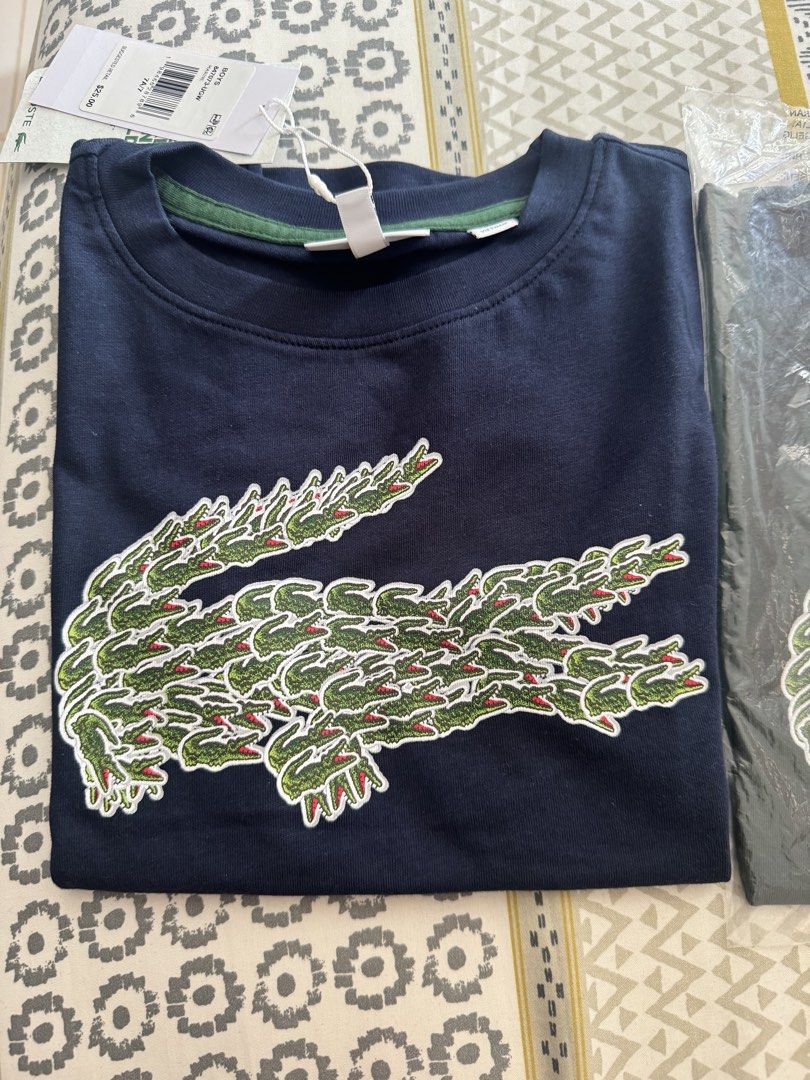 Lacoste Shirt 7t (Category: Babies & Kids Fashion) located in Cordova. Submitted by mdarylshay84786 (Listing ID 1463162553, Image 1). Description: .
