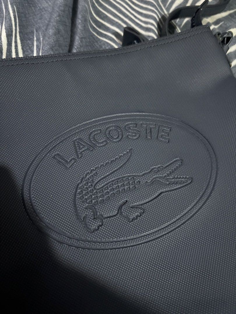 Lacoste sling bag authentic 💯 (Category: Cross-body Bags) located in General Santos City (Dadiangas). Submitted by amara_preloved (Listing ID 1463218374, Image 2). Description: excellent condition authentic w/ minimal scratches navy blue.