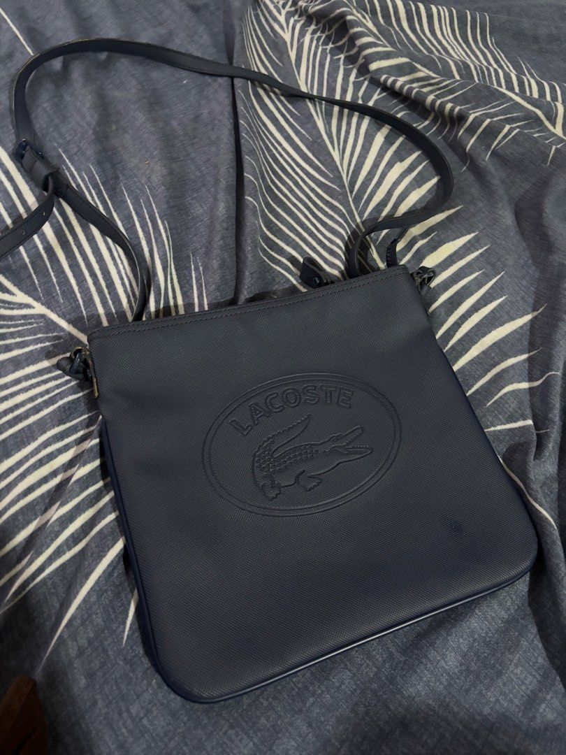Lacoste sling bag authentic 💯 (Category: Cross-body Bags) located in General Santos City (Dadiangas). Submitted by amara_preloved (Listing ID 1463218374, Image 1). Description: excellent condition authentic w/ minimal scratches navy blue.