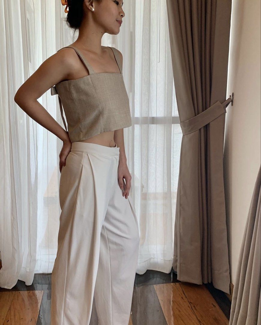 Lagom Eva Crop Top Beige (Category: Sleeveless) located in Paranaque City. Submitted by bahotaho (Listing ID 1463282243, Image 1). Description: - Bought in Frankie General Store in 2022 - Brand is not active anymore - So pretty! Esp the back details - Back area has a hidden snap buttons to adjust strap length - RFS: not into cropped tops as much anymore Helping tags: Miu the Label Phia the Label Isa the Label Beyond Collective Cariño Just Because