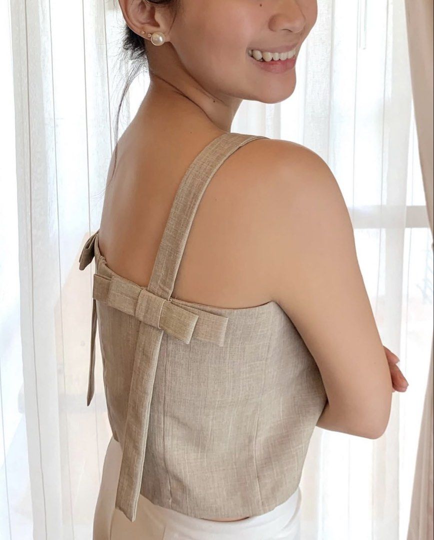 Lagom Eva Crop Top Beige (Category: Sleeveless) located in Paranaque City. Submitted by bahotaho (Listing ID 1463282243, Image 2). Description: - Bought in Frankie General Store in 2022 - Brand is not active anymore - So pretty! Esp the back details - Back area has a hidden snap buttons to adjust strap length - RFS: not into cropped tops as much anymore Helping tags: Miu the Label Phia the Label Isa the Label Beyond Collective Cariño Just Because